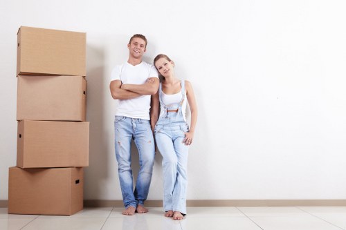 Professional removal team handling boxes in Ladbrokegrove