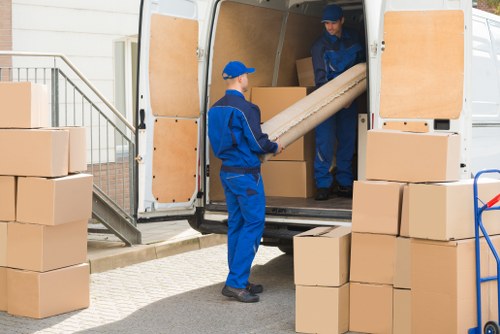 Professional movers loading furniture for a Ladbrokegrove house relocation