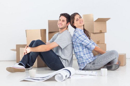 Professional team collecting unwanted furniture from a flat with stair access