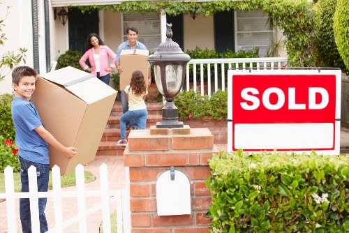 Moving team transporting furniture during a Ladbrokegrove home move