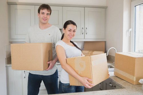 Movers protecting furniture during a flat move in Ladbrokegrove